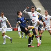 Alex Gilbey battles for the ball against Doncaster Rovers