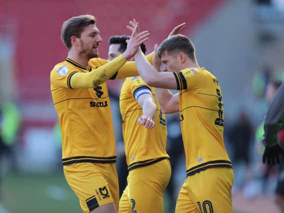 Rhys Healey celebrates his goal at Rotherham with Alex Gilbey