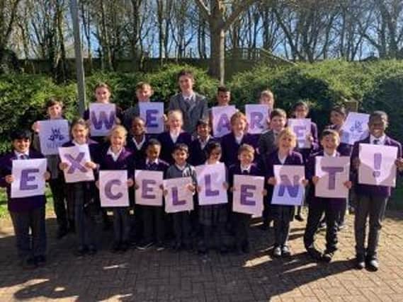 Staff and pupils at Webbers Independent School celebrate their 'excellence'