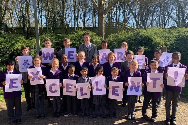 Staff and pupils at Webbers Independent School in Milton Keynes celebrate after receiving their 'excellent' rating