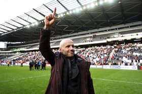 Paul Tisdale celebrates MK Dons' promotion to League One