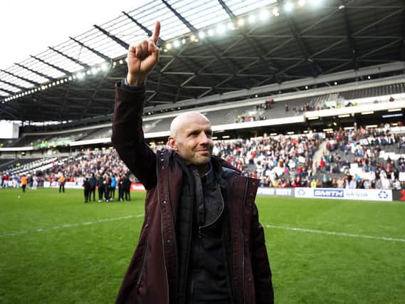 Paul Tisdale celebrates MK Dons' promotion to League One