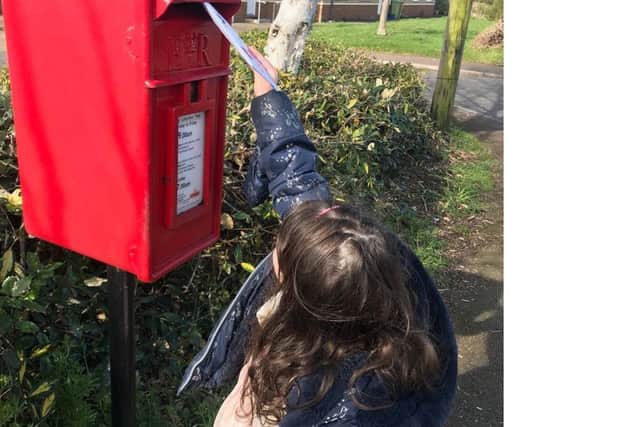 Children post their letters to the care homes