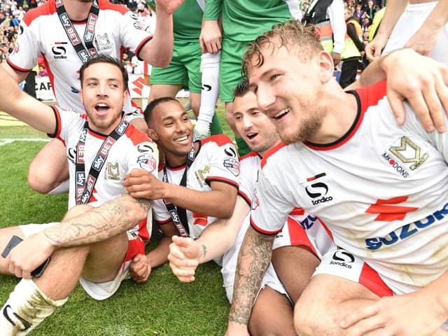Antony Kay celebrates with Samir Carruthers, Rob Hall and Kyle McFadzean