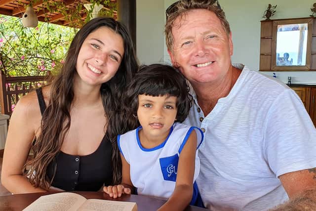 Sophie and Al with a local child