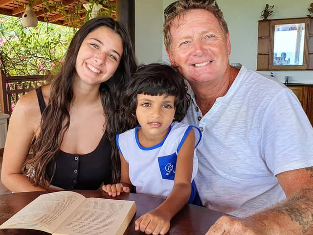 Sophie and Al with a local child