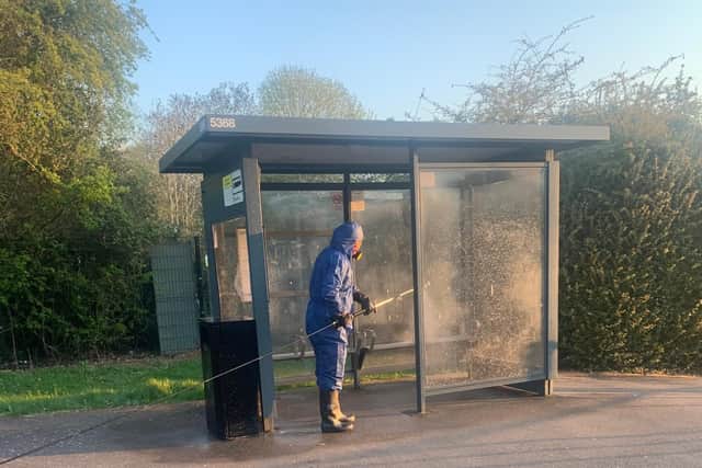 Cleaning a bus shelter