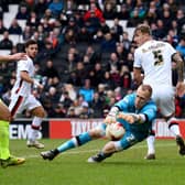 Cody Cropper in action for MK Dons
