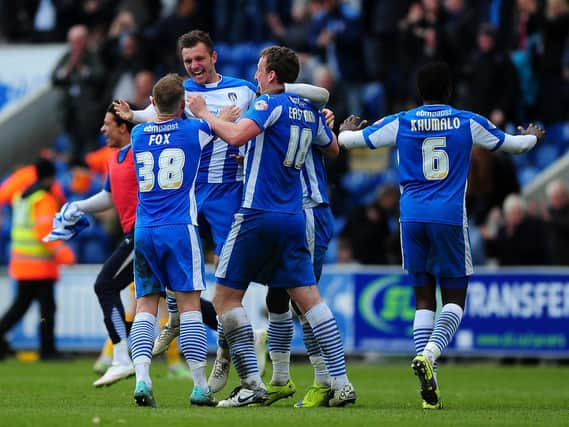 Alex Gilbey, then at Colchester, celebrates at full-time in their win over Preston