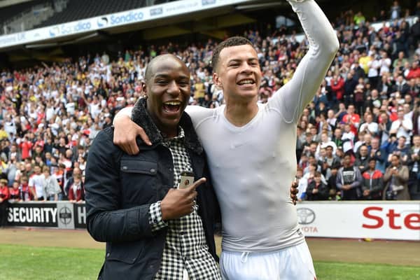 Dele Alli celebrates with Benik Afobe