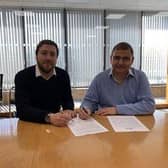 Councillors Marland (left) and McCall sign the agreement