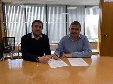 Councillors Marland (left) and McCall sign the agreement