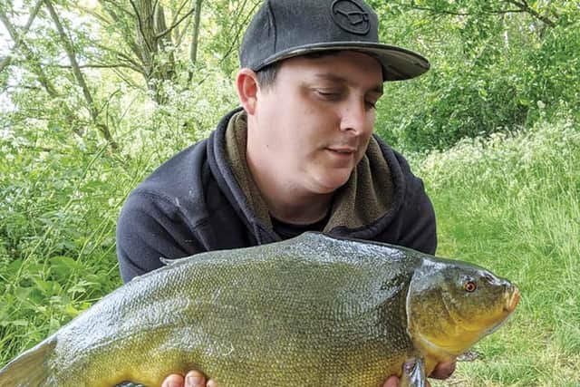 SAM Harrison-Weir's first-ever tench  8lb on the button!