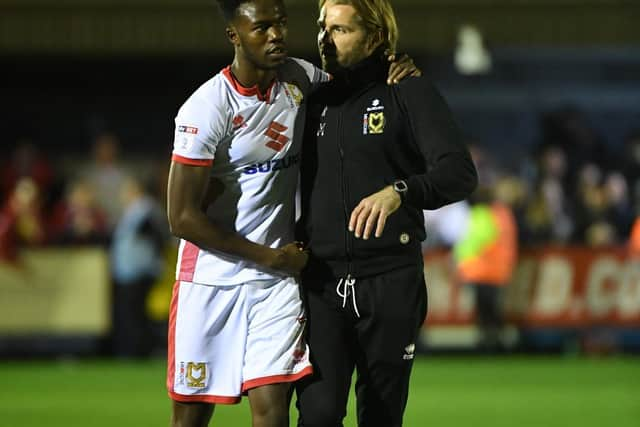 Ariyibi celebrates with Robbie Neilson after beating AFC Wimbledon