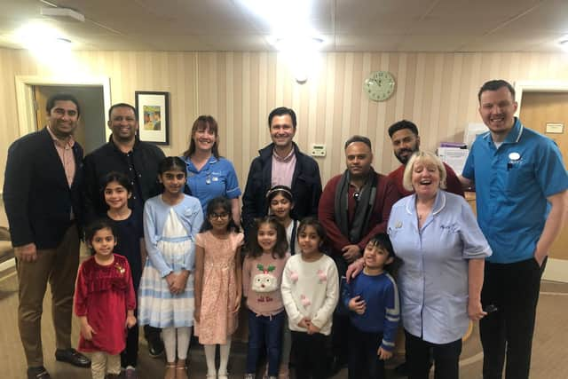 Muslims from Ahmadiyya community distributing Christmas gifts at an MK care home