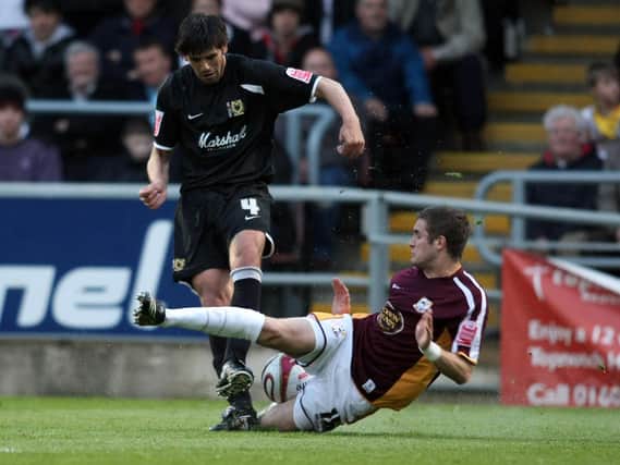 Miguel Llera in action for Dons against Northampton