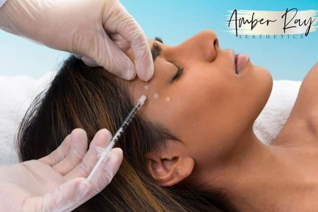 Amber wears PPE and works in a sterile environment