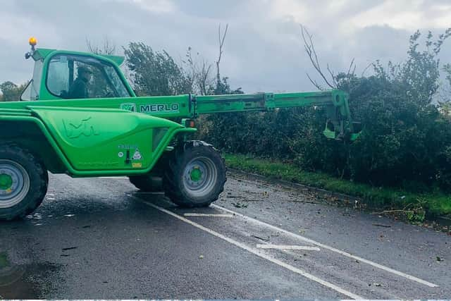 Farmers and members of the public came out to help police shift the storm debris