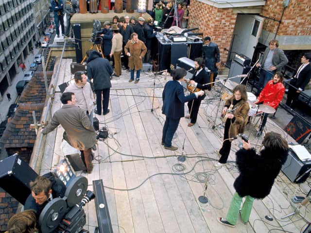 The Beatles preparing for their rooftop concert (picture: The Beatles: Get Back)