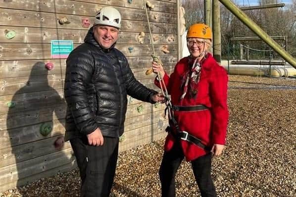 Cabinet Member for Children and Families, Cllr Zoe Nolan with climbing instructors at Caldecotte Xperience – a provider on the winter activity programme