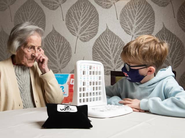 Game on, as Charlie Pelling, 8, takes on 97- year-old word fan Ruby Hill in the ultimate generation game