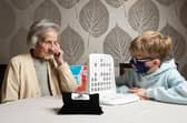 Game on, as Charlie Pelling, 8, takes on 97- year-old word fan Ruby Hill in the ultimate generation game