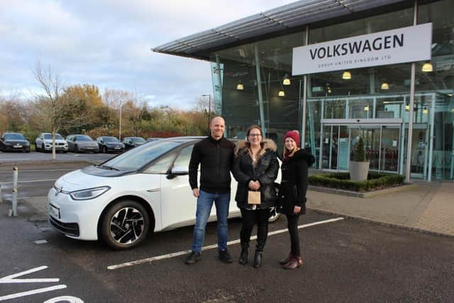 The lucky winner of the Community Foundation charity car raffle picked up her car from VW Group in Milton Keynes