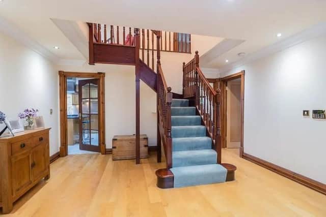 Entrance Hall
The spacious hallway features a central staircase leading to the first floor with access to cloakroom, lounge, kitchen and study. It also features wooden flooring