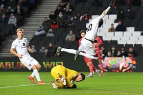Mo Eisa is just beaten to the ball by keeper Louis Jones
