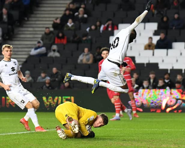 Mo Eisa is just beaten to the ball by keeper Louis Jones