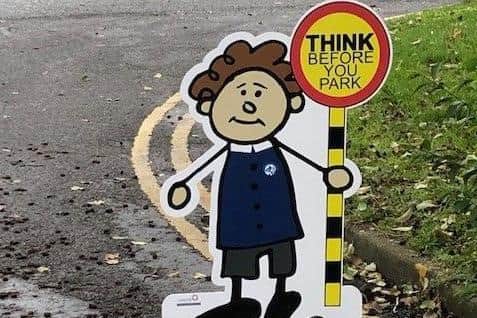 The 'little people' are placed in the road at danger spots