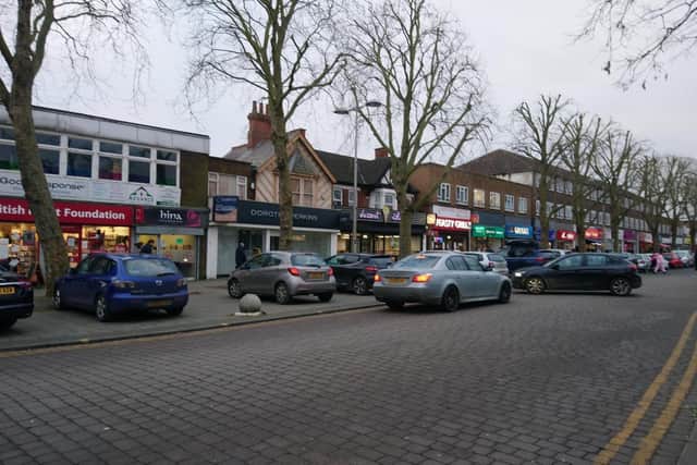 Cars parked on the pavement in Bletchley's Queensway