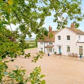 This period five bedroom former farmhouse with a detached one bedroom annexe, offers outbuildings including stables and workshops, a double carport and over 10 acres of grounds with panoramic countryside views