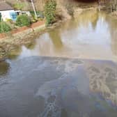The oil slick appeared in the water near the Tickford Street bridge