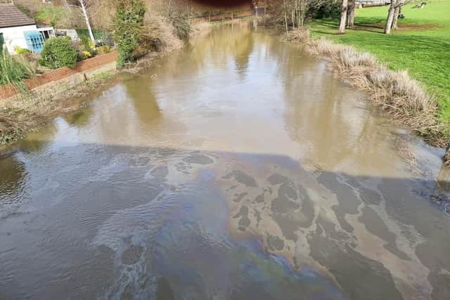 The oil slick appeared in the water near the Tickford Street bridge