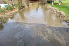 The oil slick appeared in the water near the Tickford Street bridge