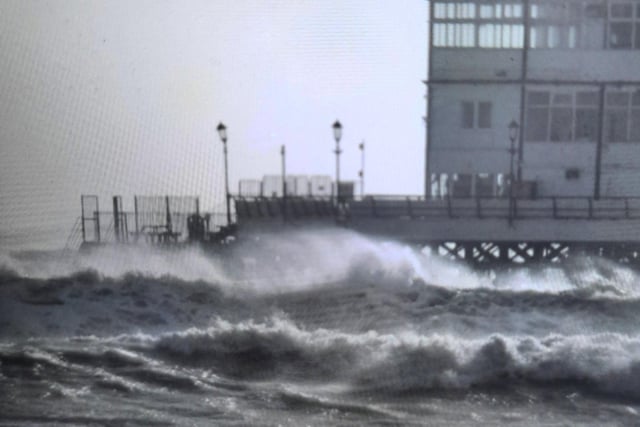 Waves crash against Eastbourne Pier. Photo by Joanne Thompson