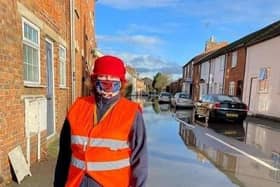 Councillor Jane Carr surveys the floods in Newport Pagnell in December 2020