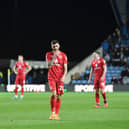 MK Dons cut dejected figures at the Kassam Stadium