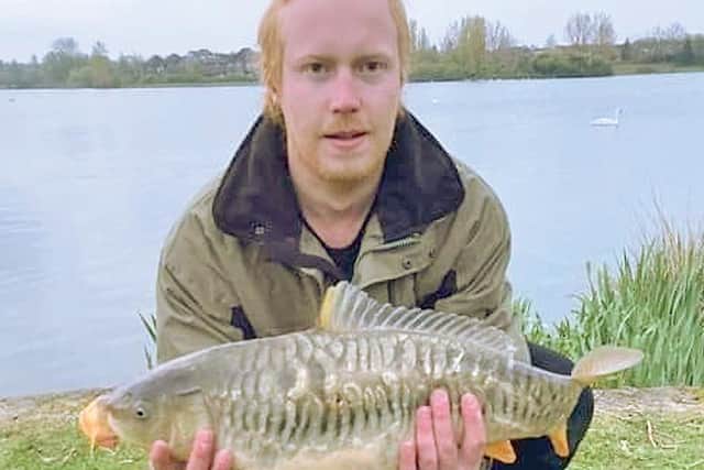 Dan Weeks with his first Furzton carp – a fully-scaled mirror