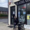 Cass outside her barbers shop
