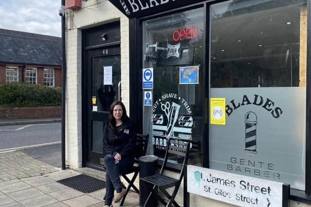 Cass outside her barbers shop