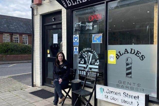 Cass outside her shop