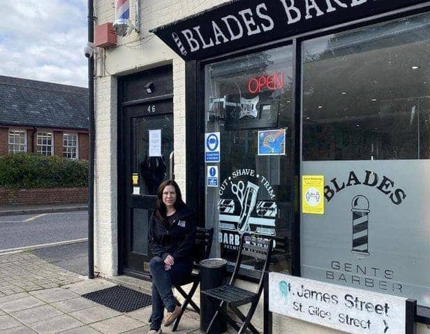 Cass outside her shop