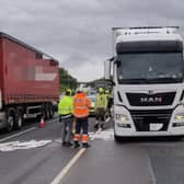 Crews work to mop up 400 litres of diesel from the M1 on Tuesday afternoon