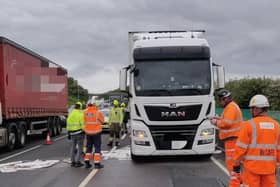 Crews work to mop up 400 litres of diesel from the M1 on Tuesday afternoon