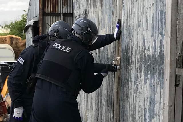 Thames Valley Police completing a drugs raid on May 26