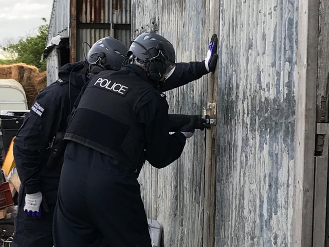 Thames Valley Police completing a drugs raid on May 26