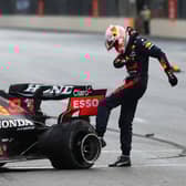 Max Verstappen shows his frustration after his tyre blows