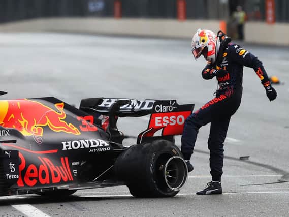 Max Verstappen shows his frustration after his tyre blows